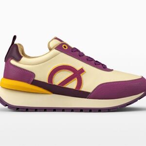 Nicki Minaj x LØCI Fusion sneakers in a cream, purple, and fuchsia colorway